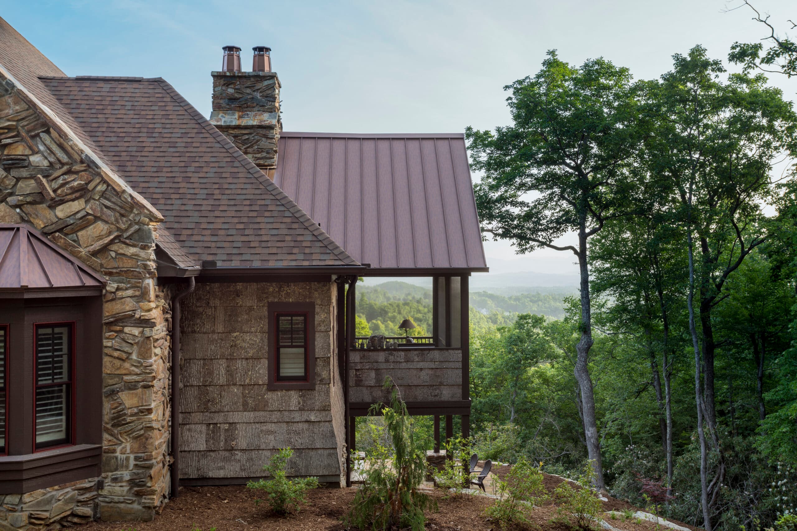 Home clad in natural poplar bark siding